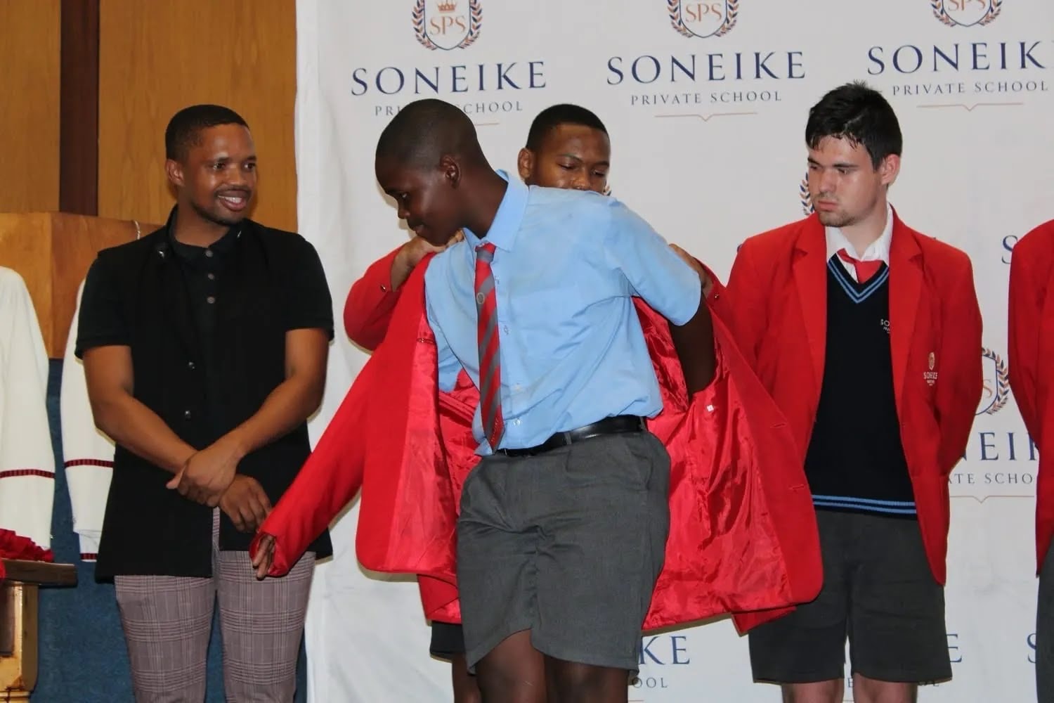 Grade 8 learners receiving their blazers at the Soneike Blazer Ceremony