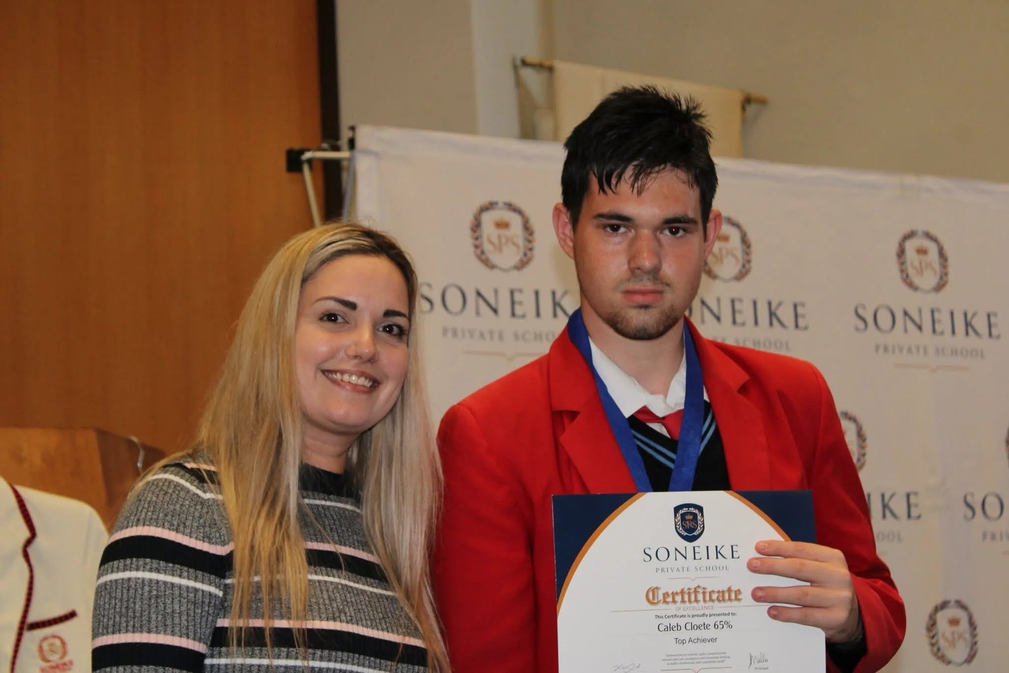 Soneike STEM School Term 1 awards — learner receiving top achiever certificate