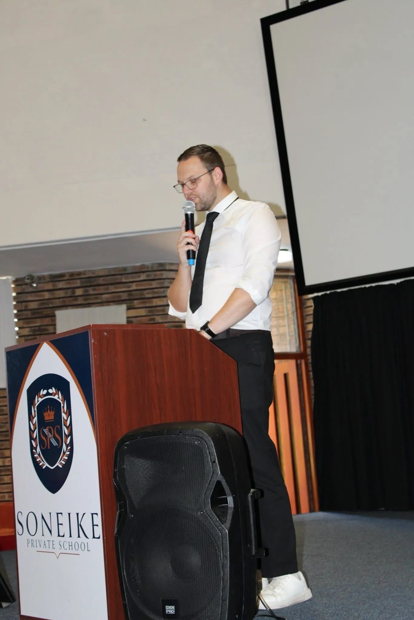 Soneike Trailblazers Term 1 awards — staff member at podium addressing learners